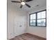 Bedroom with wood-look floors, black trim window, closet, ceiling fan and neutral paint at 4024 Landsford Rd, Marshville, NC 28103