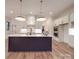 This modern kitchen features a large island, stainless steel appliances, and stylish pendant lighting at 4024 Landsford Rd, Marshville, NC 28103