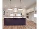 This well-lit kitchen showcases a large island, modern appliances, and ample counter space at 4024 Landsford Rd, Marshville, NC 28103
