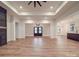 This spacious living room features a fireplace, wood floors, and double doors leading to the outside at 4024 Landsford Rd, Marshville, NC 28103