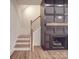 Cozy living room with a dark fireplace and staircase with wood steps and a decorative railing at 4024 Landsford Rd, Marshville, NC 28103