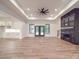 Spacious living room with a ceiling fan, backyard access, fireplace, and hardwood floors at 4024 Landsford Rd, Marshville, NC 28103