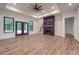 Open-concept living room with a fireplace, access to the backyard, and plenty of natural light at 4024 Landsford Rd, Marshville, NC 28103