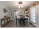Cozy dining room with wooden floors, a white table, and farmhouse decor at 403 Easy St, Concord, NC 28027