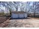 Detached two-car garage with a concrete driveway and a fenced perimeter at 403 Easy St, Concord, NC 28027