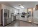 Bright kitchen with stainless steel appliances, granite counter tops, and white cabinets at 403 Easy St, Concord, NC 28027