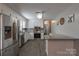 Bright kitchen with stainless steel appliances, granite counter tops, and white cabinets at 403 Easy St, Concord, NC 28027