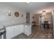 Open-concept kitchen with granite countertops, stainless steel appliances, and an adjacent dining area at 403 Easy St, Concord, NC 28027