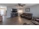 Spacious living room with hardwood floors, a cozy fireplace, and a modern entertainment center at 403 Easy St, Concord, NC 28027