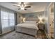 Serene main bedroom with a large bed, soft lighting, and stylish decor at 403 Easy St, Concord, NC 28027