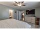 Relaxing main bedroom with a cozy bed, modern decor, and access to an en-suite bathroom and closet at 403 Easy St, Concord, NC 28027