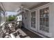 Cozy covered porch with ceiling fan and inviting seating arrangement at 403 Easy St, Concord, NC 28027