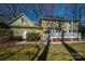 Expansive backyard showcasing a deck, lawn, and the home's exterior under a clear blue sky at 4301 Old Forge Dr, Gastonia, NC 28056