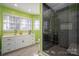 Elegant bathroom with modern shower, sleek vanity, and bright windows at 4301 Old Forge Dr, Gastonia, NC 28056