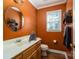 Bathroom featuring a vanity with a round mirror and window at 4301 Old Forge Dr, Gastonia, NC 28056