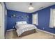 Stylish bedroom with blue walls, white shelves, and bright natural light at 4301 Old Forge Dr, Gastonia, NC 28056