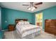 Comfortable bedroom featuring a ceiling fan and an attached bathroom for added convenience at 4301 Old Forge Dr, Gastonia, NC 28056