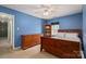 Bedroom featuring wooden furniture and ample natural light, creating a comfortable and inviting space at 4301 Old Forge Dr, Gastonia, NC 28056
