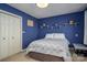 Cozy bedroom with a closet, shelves, and neutral carpet flooring at 4301 Old Forge Dr, Gastonia, NC 28056
