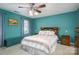 Bedroom featuring a cozy quilt, window, and bedside tables, offering a comfortable retreat at 4301 Old Forge Dr, Gastonia, NC 28056