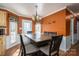 Inviting dining area with traditional decor, an elegant chandelier, and natural lighting at 4301 Old Forge Dr, Gastonia, NC 28056