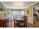 Dining room with large table, chandelier, and natural light at 4301 Old Forge Dr, Gastonia, NC 28056