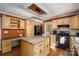 Bright kitchen features an island, modern appliances, and wooden cabinets at 4301 Old Forge Dr, Gastonia, NC 28056