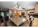 Open kitchen and dining area with wood cabinetry, granite countertops, and modern appliances at 4301 Old Forge Dr, Gastonia, NC 28056