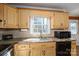 Kitchen featuring laminate countertops, tile backsplash, stainless steel sink, and modern appliances at 4301 Old Forge Dr, Gastonia, NC 28056