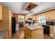 Kitchen boasts wood cabinets, modern appliances, and an adjacent dining area for seamless entertaining at 4301 Old Forge Dr, Gastonia, NC 28056