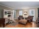 Inviting living room with desk, comfy chairs, and natural light at 4301 Old Forge Dr, Gastonia, NC 28056