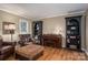 Cozy living room features a piano, bookshelves, and comfortable seating at 4301 Old Forge Dr, Gastonia, NC 28056