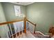 Staircase with chandelier and view of the home's entry at 4301 Old Forge Dr, Gastonia, NC 28056