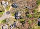 Aerial view showcases the property boundaries of a home nestled in a wooded, residential area at 4522 Pendock Ct, Charlotte, NC 28226