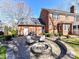 The backyard features a firepit, a patio, some furniture and access to the house and driveway at 4522 Pendock Ct, Charlotte, NC 28226