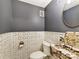 Featuring dark gray paint and mosaic marble tiles, this powder room is elegant and modern at 4522 Pendock Ct, Charlotte, NC 28226