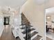Warm and welcoming foyer leading to an elegant staircase at 4522 Pendock Ct, Charlotte, NC 28226