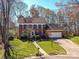 Charming two-story brick home with manicured lawn and attached garage, offering classic curb appeal at 4522 Pendock Ct, Charlotte, NC 28226