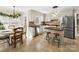 Bright kitchen with stainless steel appliances, center island with seating, and lots of natural light at 4522 Pendock Ct, Charlotte, NC 28226