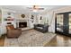 Cozy living room with brick fireplace, built-in shelving, and comfortable seating at 4522 Pendock Ct, Charlotte, NC 28226