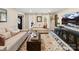 Comfortable living room featuring neutral furniture, a large TV, and stylish decor at 4522 Pendock Ct, Charlotte, NC 28226
