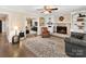 Inviting living room with hardwood floors, fireplace, and comfortable seating arrangement at 4522 Pendock Ct, Charlotte, NC 28226