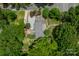 Aerial view of a private estate surrounded by lush greenery, showcasing the home's expansive layout at 4531 Montibello Dr, Charlotte, NC 28226