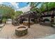 Gorgeous backyard patio featuring fire pit, hot tub, and outdoor kitchen at 4531 Montibello Dr, Charlotte, NC 28226