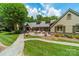Beautiful backyard with a stone walkway, lush landscaping, and a tranquil patio with outdoor seating at 4531 Montibello Dr, Charlotte, NC 28226
