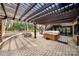 Inviting brick patio with pergola, hot tub, and stone fire pit at 4531 Montibello Dr, Charlotte, NC 28226