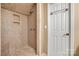 A bathroom featuring tiled shower and stone-look tiled walls at 4531 Montibello Dr, Charlotte, NC 28226