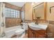 Bathroom with a vanity, toilet, and tiled tub at 4531 Montibello Dr, Charlotte, NC 28226