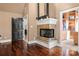 Cozy bedroom featuring a fireplace and large walk-in closet at 4531 Montibello Dr, Charlotte, NC 28226