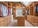 Walk-in closet featuring custom built-ins, shelves, drawers and a skylight at 4531 Montibello Dr, Charlotte, NC 28226